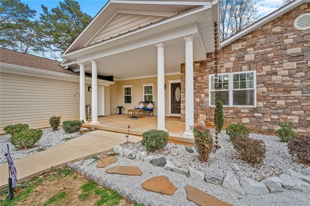 doorway to property featuring covered porch