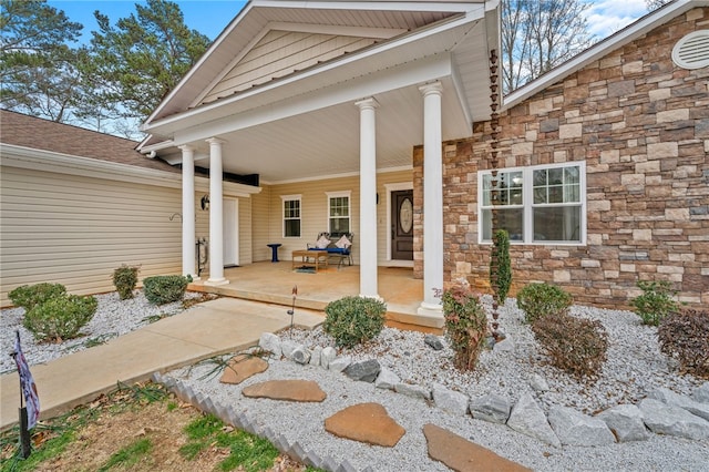 property entrance with covered porch