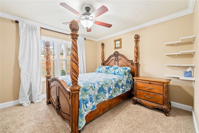 carpeted bedroom with ceiling fan and ornamental molding