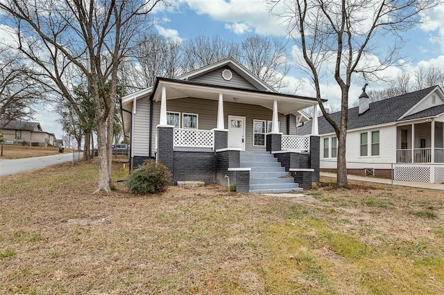 view of front of property with a front lawn and a porch