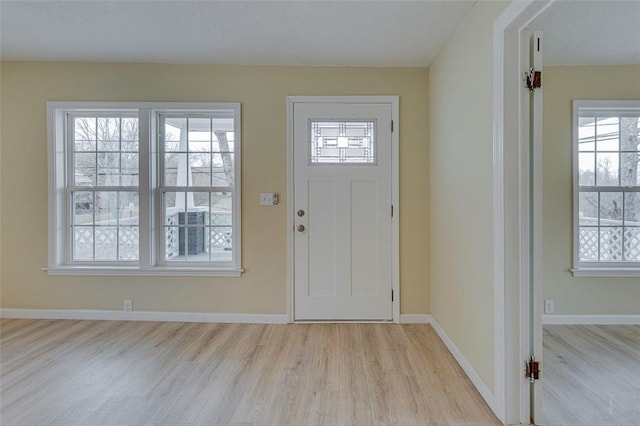 foyer with light wood-type flooring