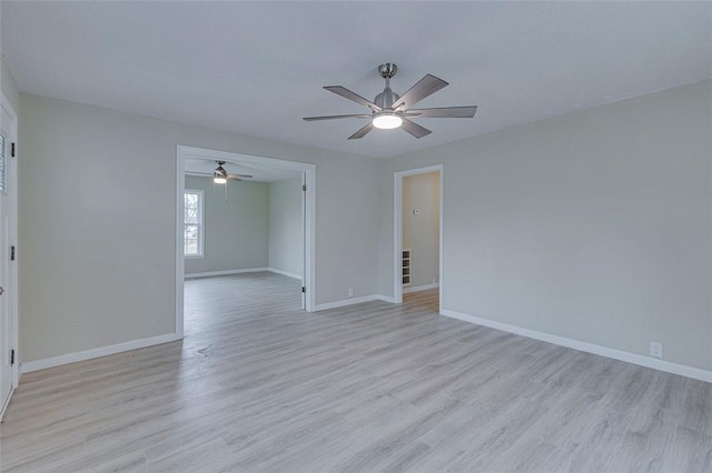 spare room featuring ceiling fan and light hardwood / wood-style floors