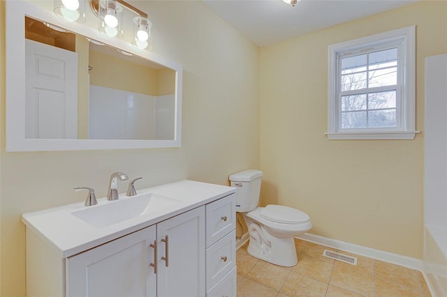 bathroom with tile patterned floors, toilet, and vanity