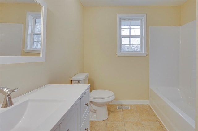 bathroom with toilet, tile patterned floors, and vanity