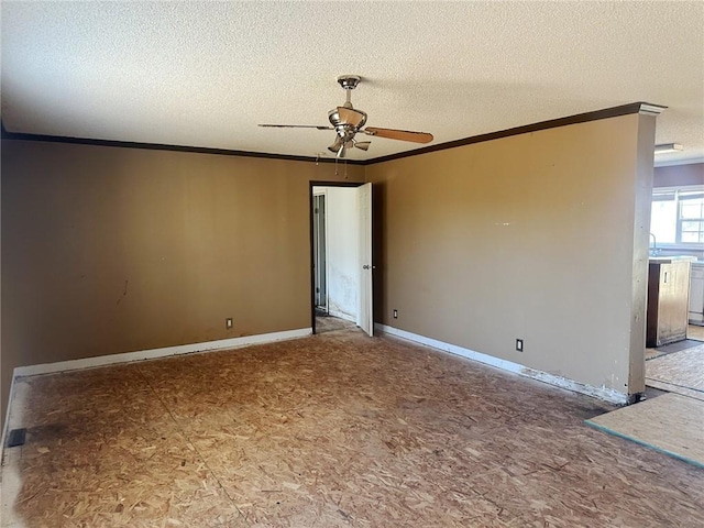 spare room with ceiling fan, sink, a textured ceiling, and ornamental molding