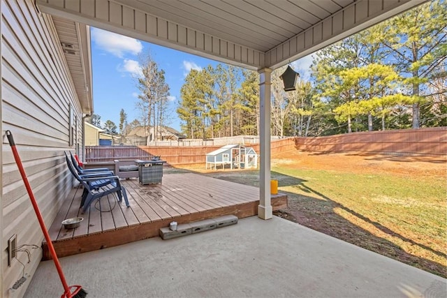 deck with a lawn and a patio