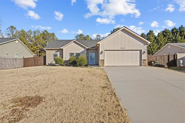 ranch-style home featuring a garage