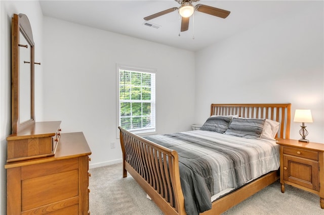 bedroom featuring ceiling fan and light carpet