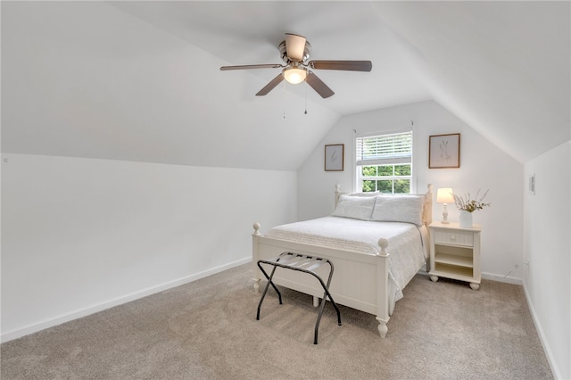 carpeted bedroom with lofted ceiling and ceiling fan