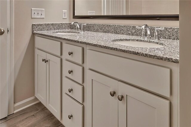 bathroom featuring hardwood / wood-style floors and vanity