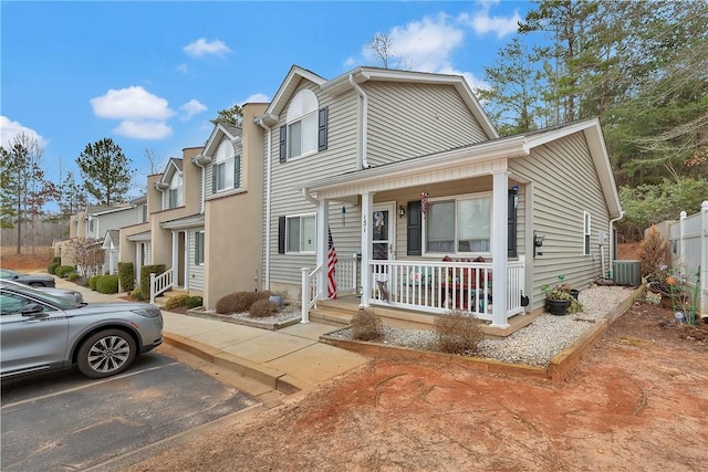 view of front of property with a porch and central AC unit