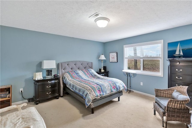 carpeted bedroom with a textured ceiling