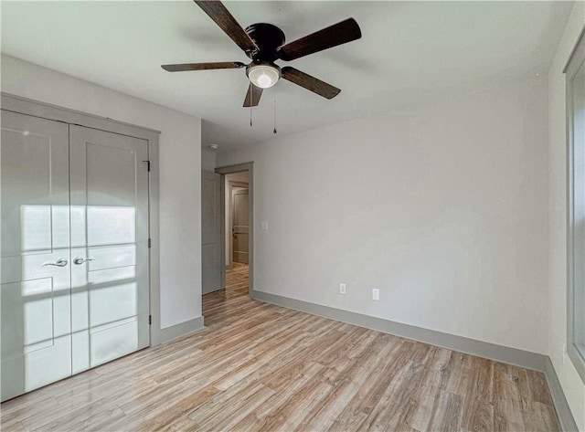 unfurnished room with ceiling fan and light hardwood / wood-style floors