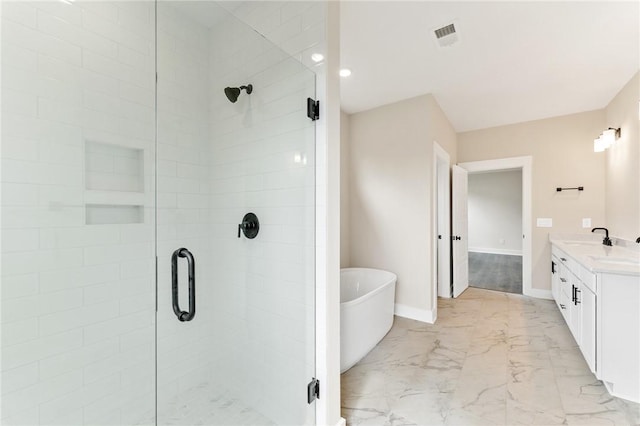 bathroom with vanity and separate shower and tub