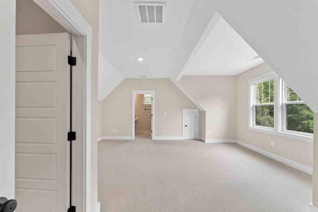 bonus room featuring carpet flooring and lofted ceiling