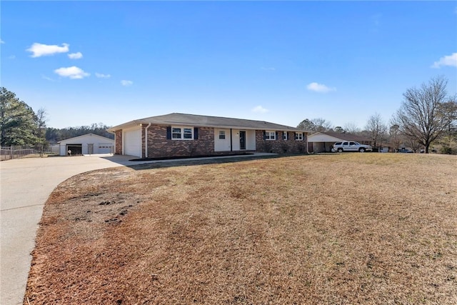 ranch-style house with a garage and a front lawn