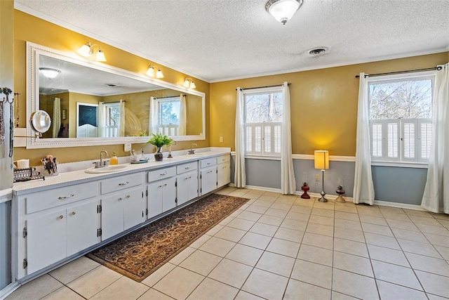 bathroom featuring a textured ceiling, tile patterned floors, and vanity