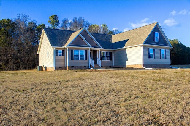 view of front of property featuring a front lawn and central AC