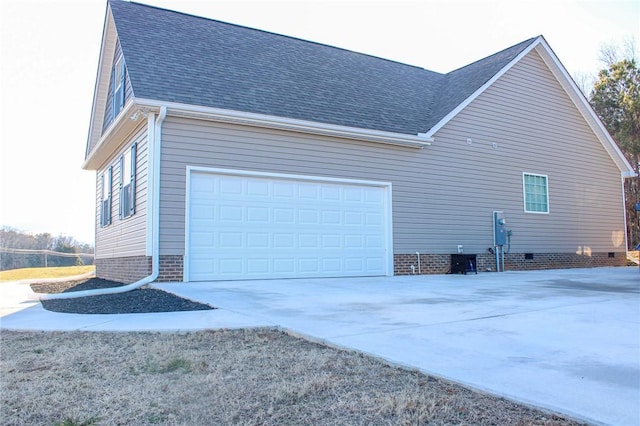 view of side of home featuring a garage