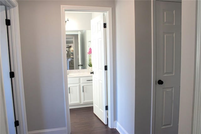 hall with dark hardwood / wood-style floors