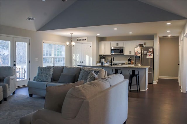 626 Johnny Long Rd, Iva, SC 29655 - living room with recessed lighting, an inviting chandelier, french doors, dark wood finished floors, and visible vents