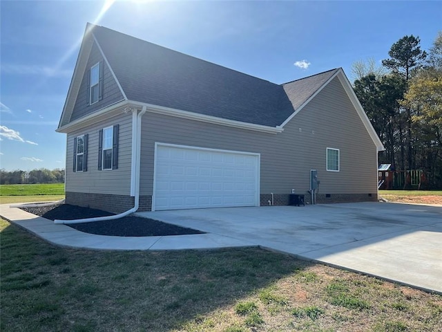 626 Johnny Long Rd, Iva, SC 29655 - view of side of home featuring roof with shingles, crawl space, driveway, a garage, and a lawn
