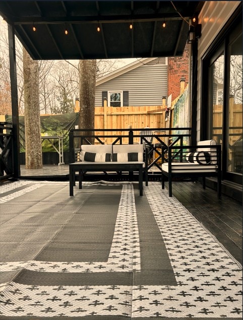 view of patio / terrace featuring fence