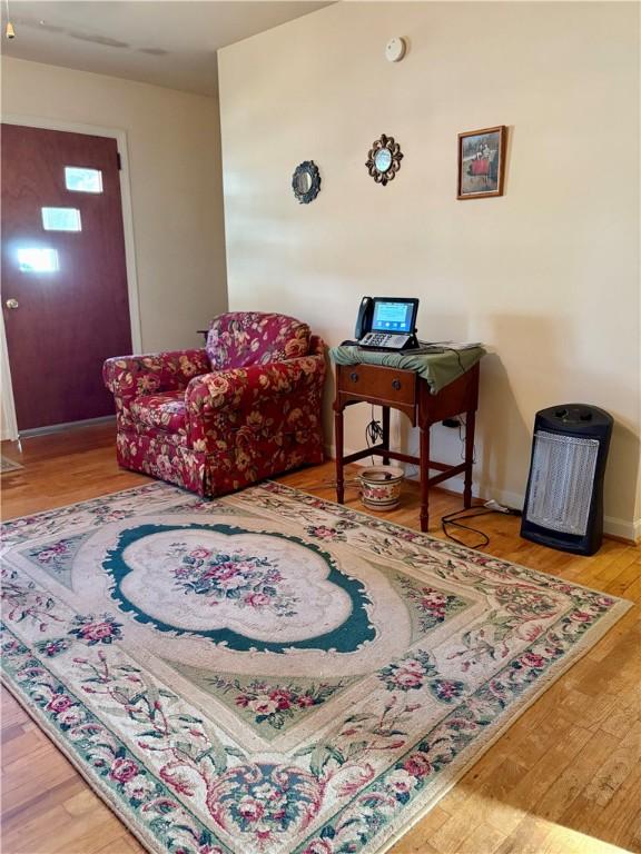 sitting room featuring wood-type flooring