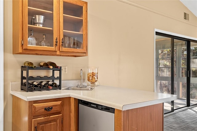 bar with dishwasher, vaulted ceiling, sink, and carpet flooring