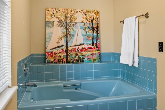 bathroom with tiled bath