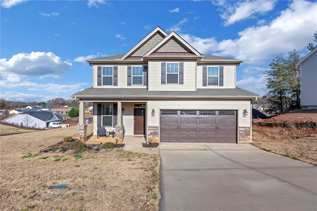 craftsman inspired home with a garage and covered porch