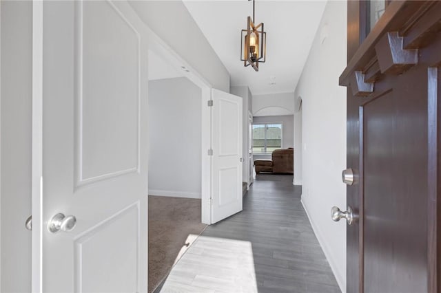 hall with dark hardwood / wood-style floors