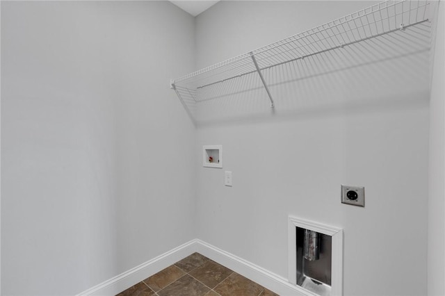 laundry area with dark tile patterned floors, electric dryer hookup, and washer hookup