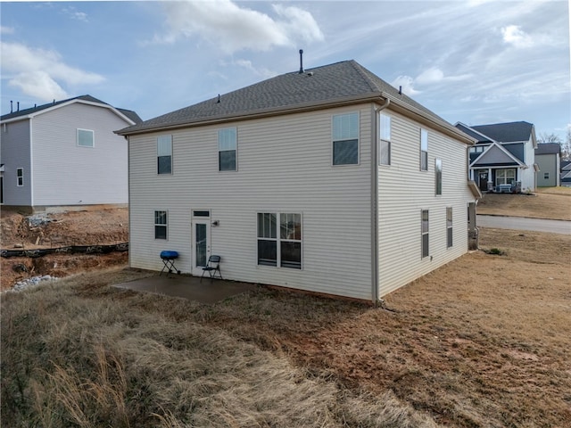 back of house with a patio area