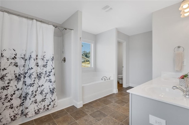 full bathroom with vanity, plus walk in shower, and toilet