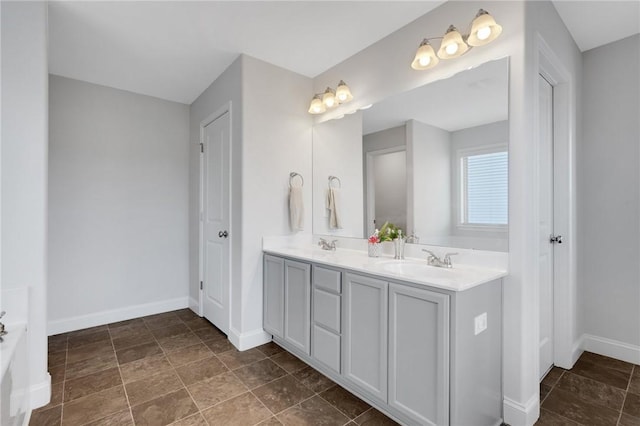 bathroom featuring vanity and a tub