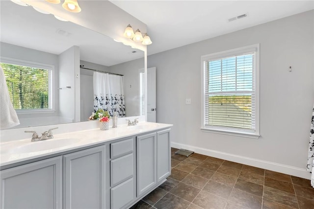 bathroom featuring vanity and a shower with curtain