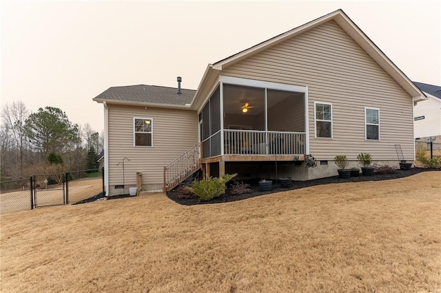 back of property featuring crawl space, a yard, and fence