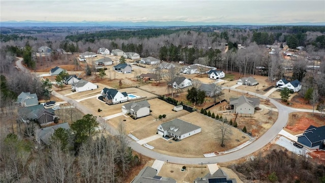 aerial view featuring a residential view and a view of trees