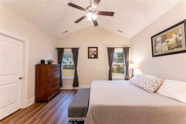 bedroom featuring lofted ceiling, dark wood-type flooring, and ceiling fan