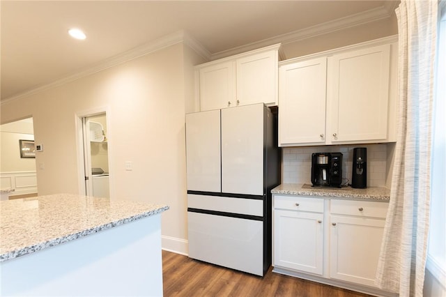 kitchen featuring white cabinetry, light stone countertops, dark hardwood / wood-style floors, and white fridge