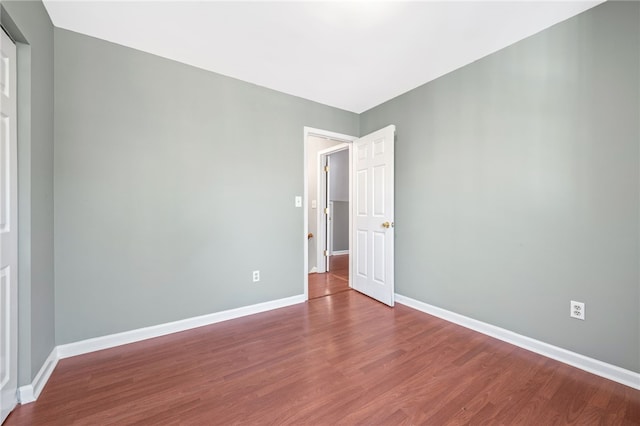 empty room featuring hardwood / wood-style flooring