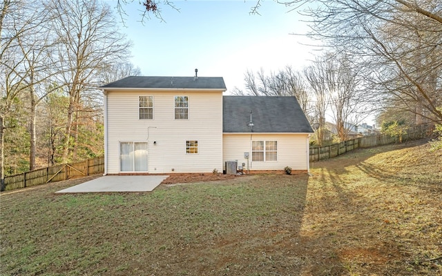 back of property featuring cooling unit, a yard, and a patio