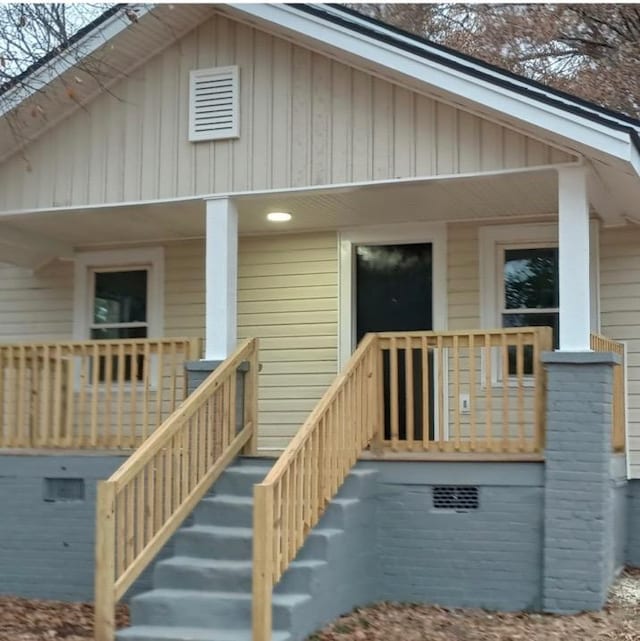 doorway to property with a porch