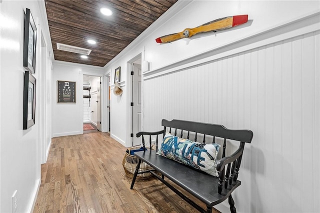 hallway featuring visible vents, ornamental molding, wood finished floors, recessed lighting, and wood ceiling