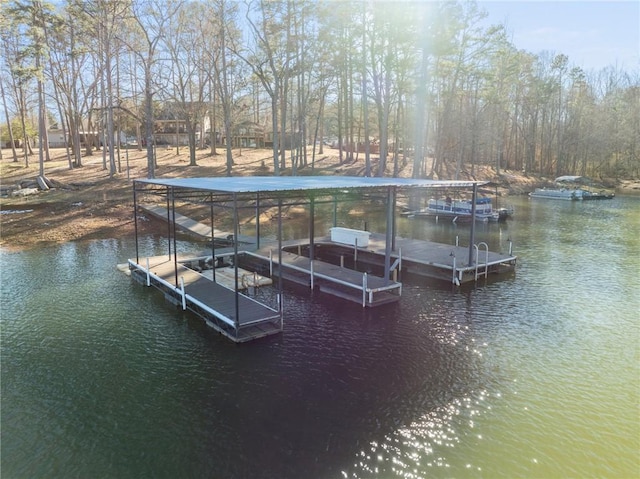 view of dock with boat lift and a water view