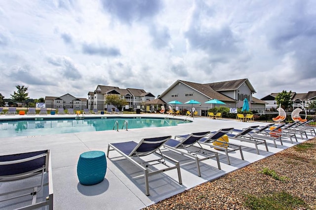 view of swimming pool featuring a patio