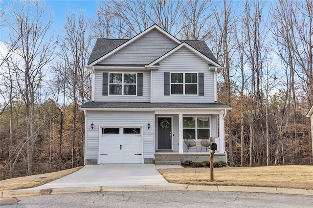 view of front facade with a garage and covered porch