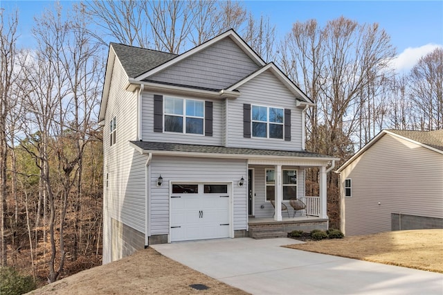 view of front facade featuring a garage and covered porch