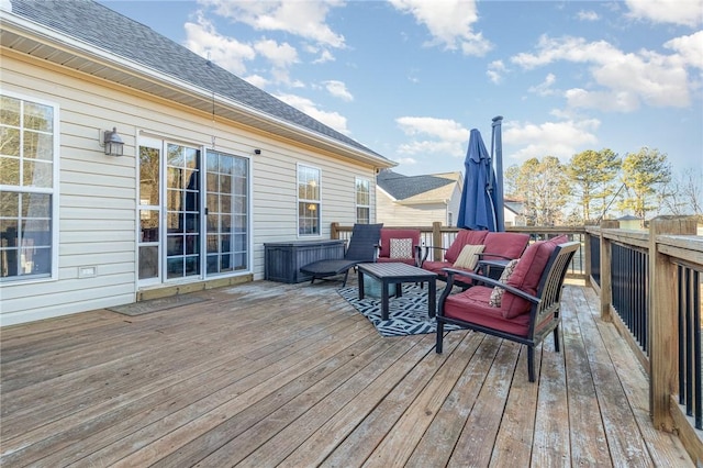 wooden deck featuring outdoor lounge area